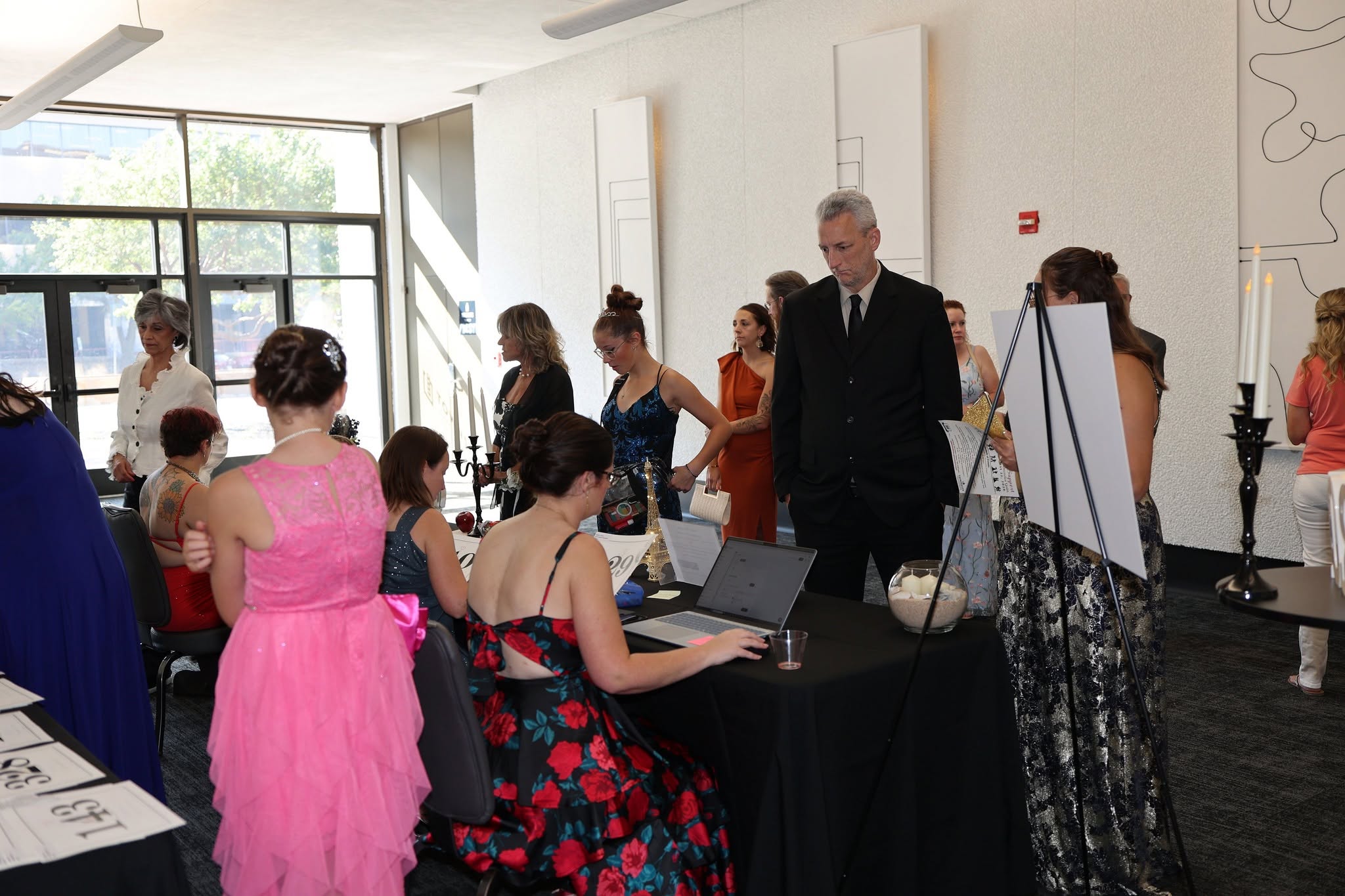 volunteers checking people into the Gala