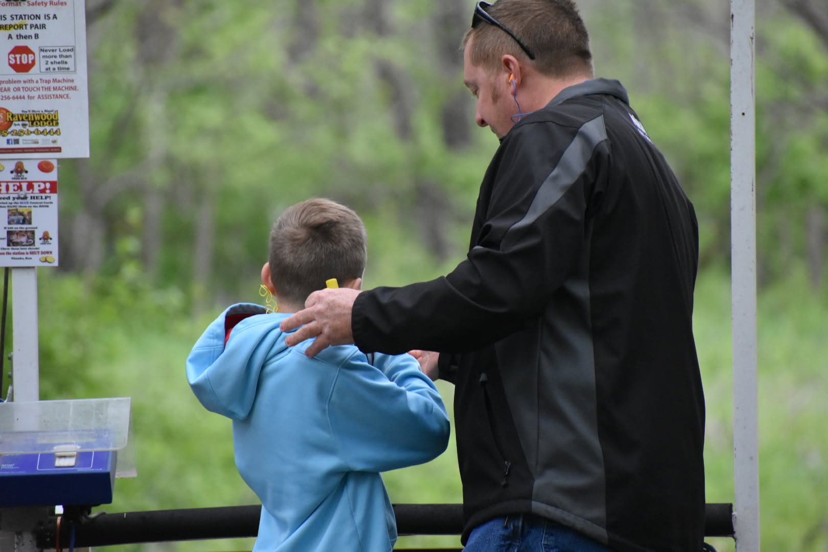 Father helping his son while attending on of the Shoot Fundraisers